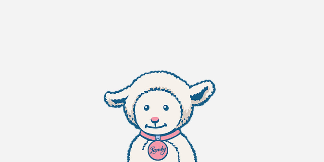 A stuffed Lamb toy with a pink collar with a locket named Lamby 