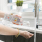 A Lady washing her hands using Nellie's One Soap